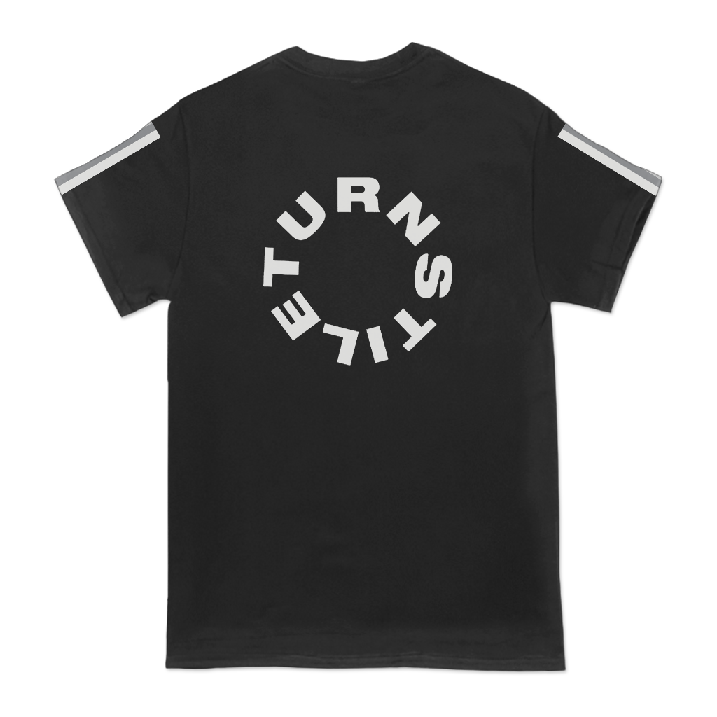 Turnstile's "Dan Never Enough" design, printed on the front, back and both sleeves of a black tee with a custom woven tag.