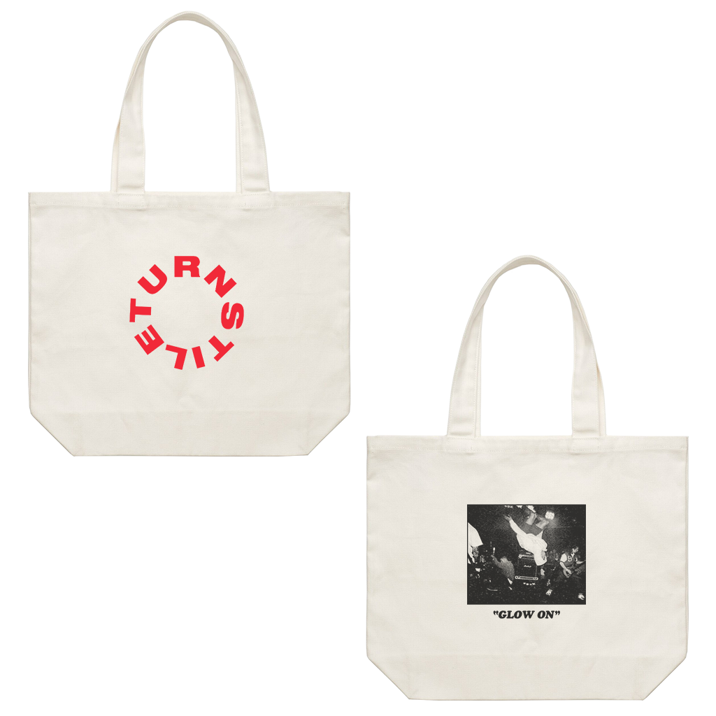 Turnstile's "Flip" design, printed on the front and back of a natural canvas tote bag. Tote features: Reinforced should straps; one large main compartment; Mid weight, 9.4 oz/yd2; 100% cotton canvas.