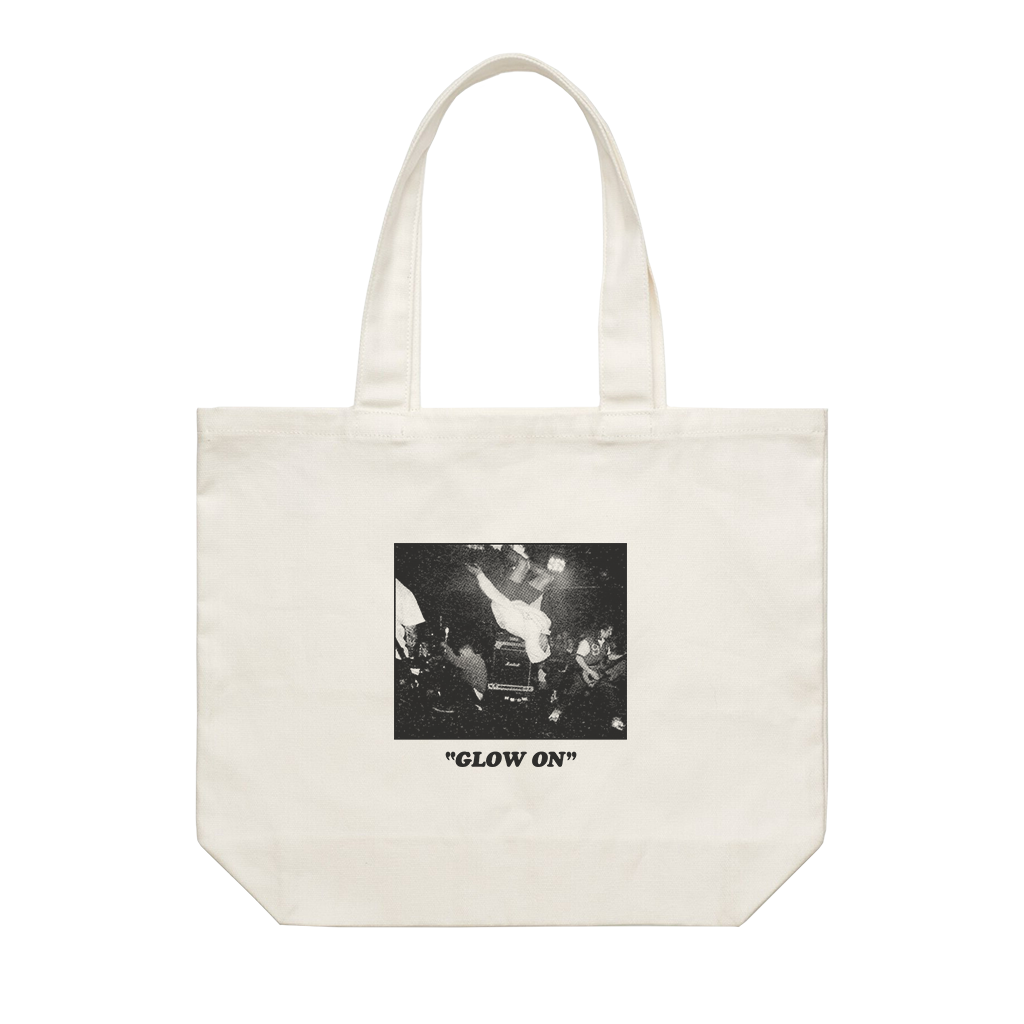 Turnstile's "Flip" design, printed on the front and back of a natural canvas tote bag. Tote features: Reinforced should straps; one large main compartment; Mid weight, 9.4 oz/yd2; 100% cotton canvas.