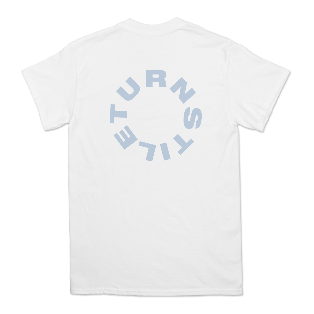 Turnstile's "Live Birds" design, printed on the front and back of a white tee with a custom printed tag.