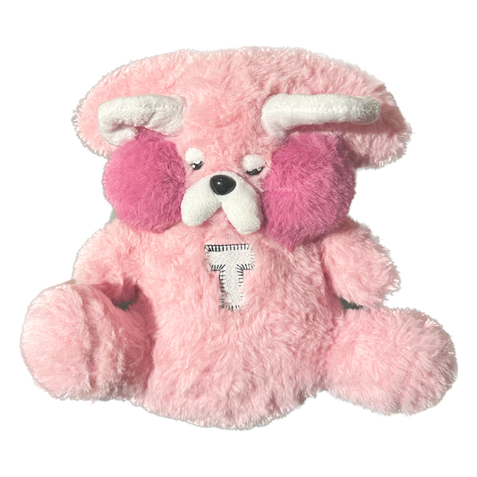 Turnstile's highly coveted pink plushie bear measures 7" tall and features soft horns and wings with a custom "T" patch sewn onto the belly. Plushie made in collaboration with Plushie Love.