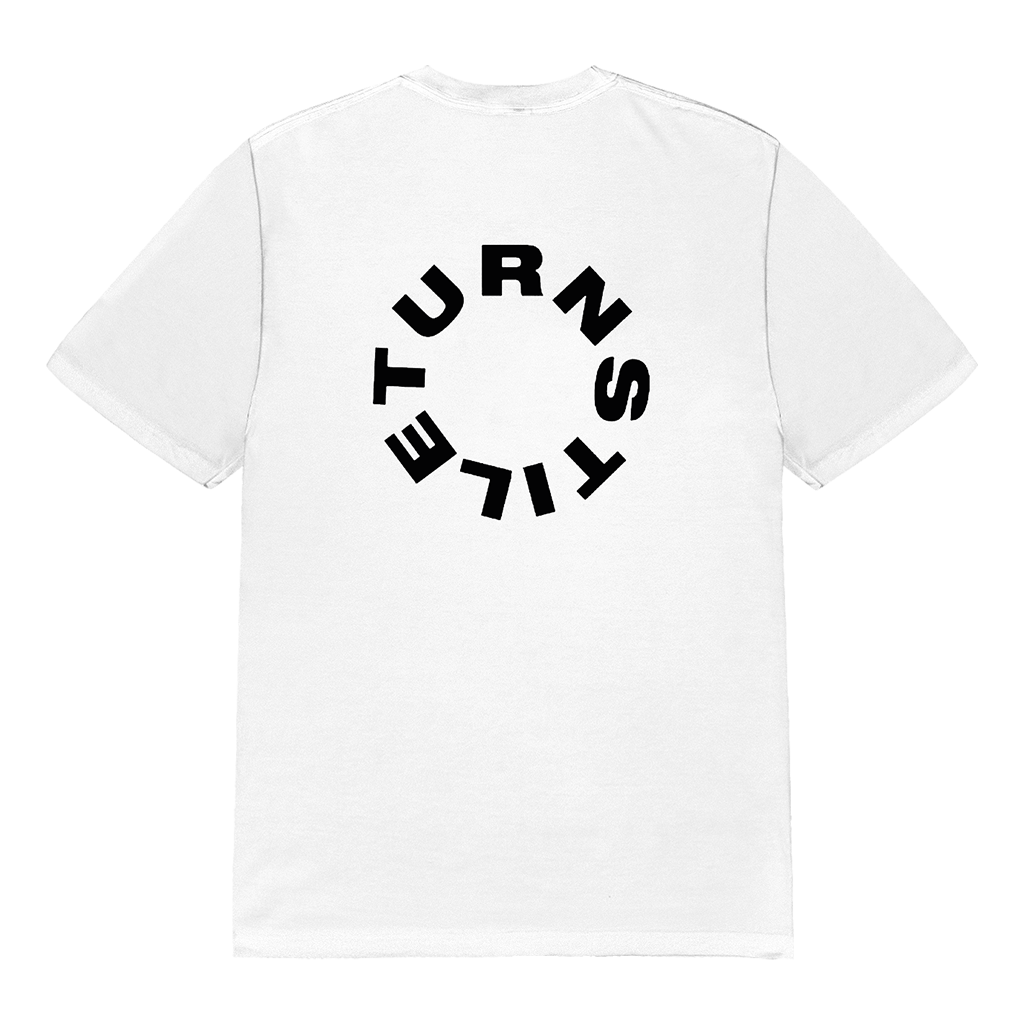 Turnstile's "Never Enough Stage" design, printed on the front and back of a white tee with a custom woven tag.